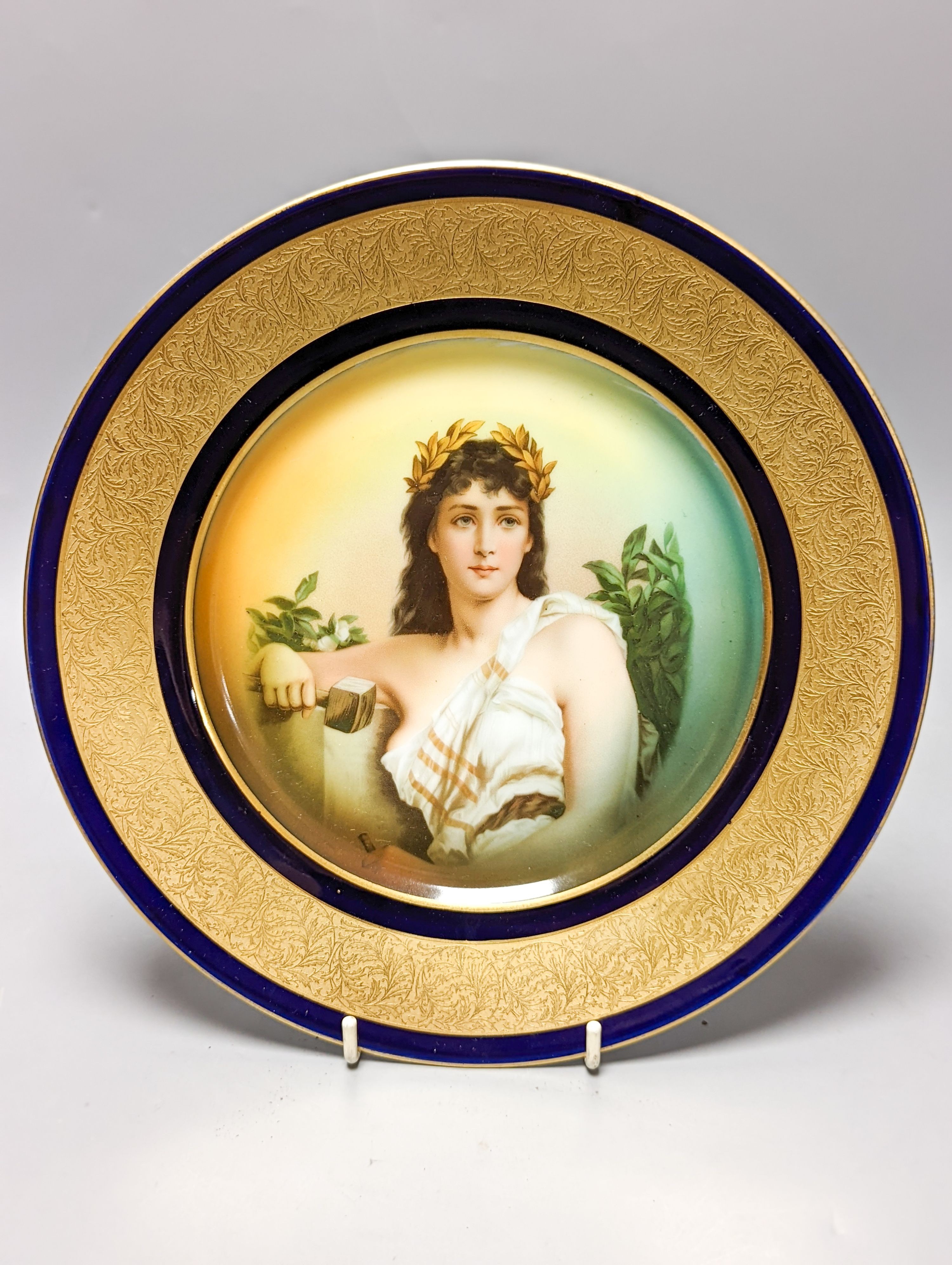 A Rosenthal painted porcelain portrait plate, early 20th century and a Royal Crown Derby gilded pheasant plate 26cm
